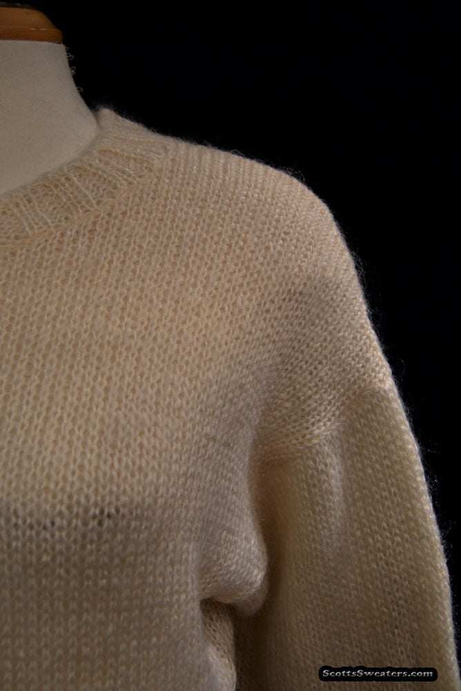 Woman's ivory crewneck mohair and wool long sleeve sweater size 42
