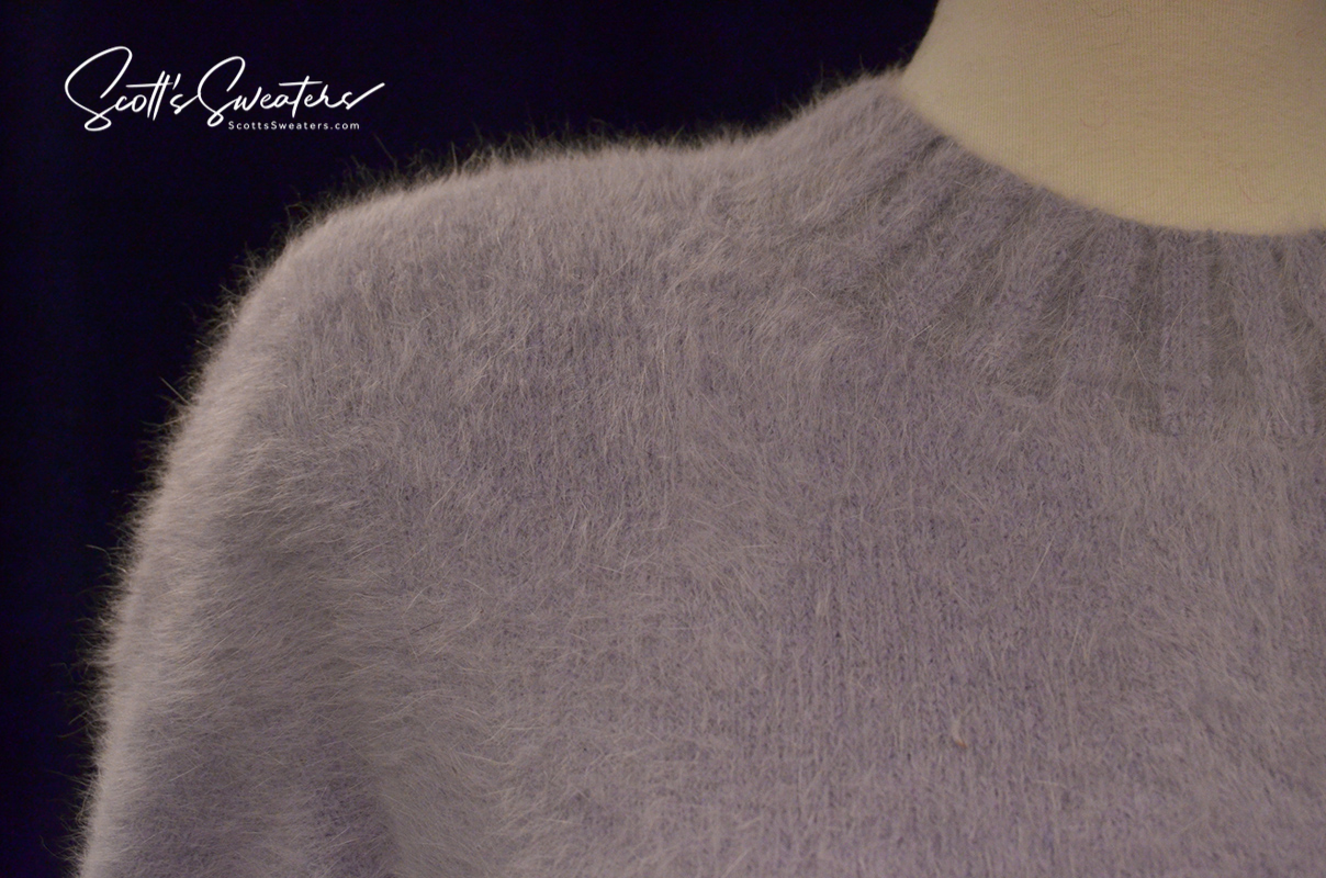 Light-blue angora crewneck sweaterdress with soft fuzzy texture on mannequin