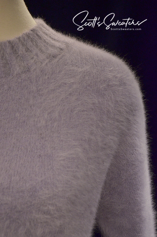 Close-up of a soft light-blue angora crewneck sweaterdress showing fuzzy texture