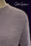 Close-up of a soft light-blue angora crewneck sweaterdress showing fuzzy texture