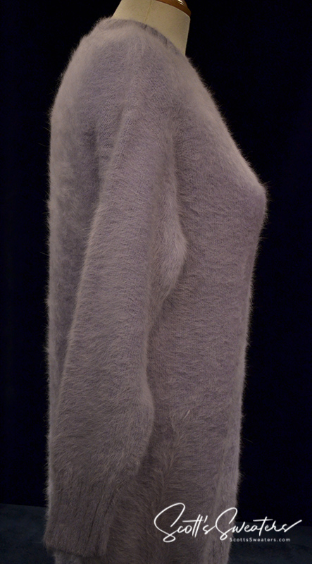 Light-blue angora sweaterdress with soft fuzzy texture and long sleeves on mannequin side view