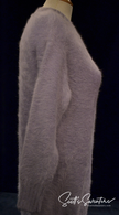 Light-blue angora sweaterdress with soft fuzzy texture and long sleeves on mannequin side view