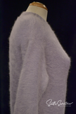 Light-blue angora crewneck sweaterdress on mannequin, soft and cozy fabric.