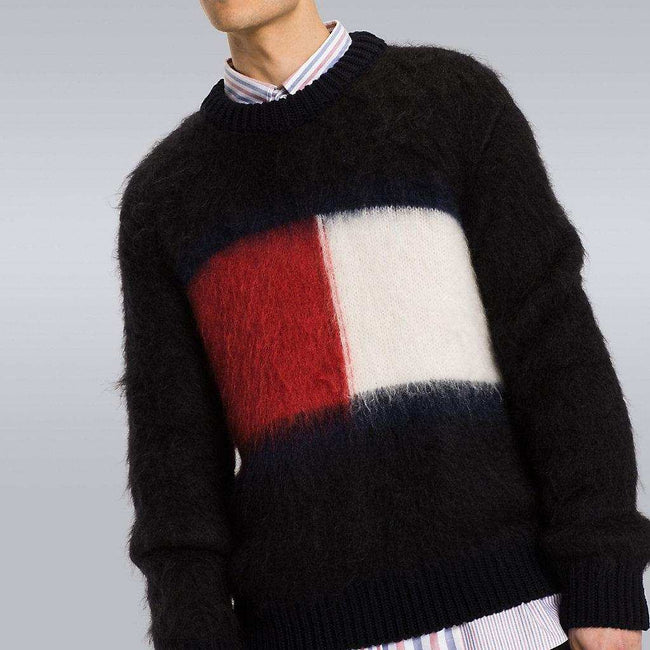 Men's black Tommy Hilfiger mohair crewneck sweater with large red, white, and navy flag logo on chest