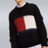Men's black Tommy Hilfiger mohair crewneck sweater with large red, white, and navy flag logo on chest