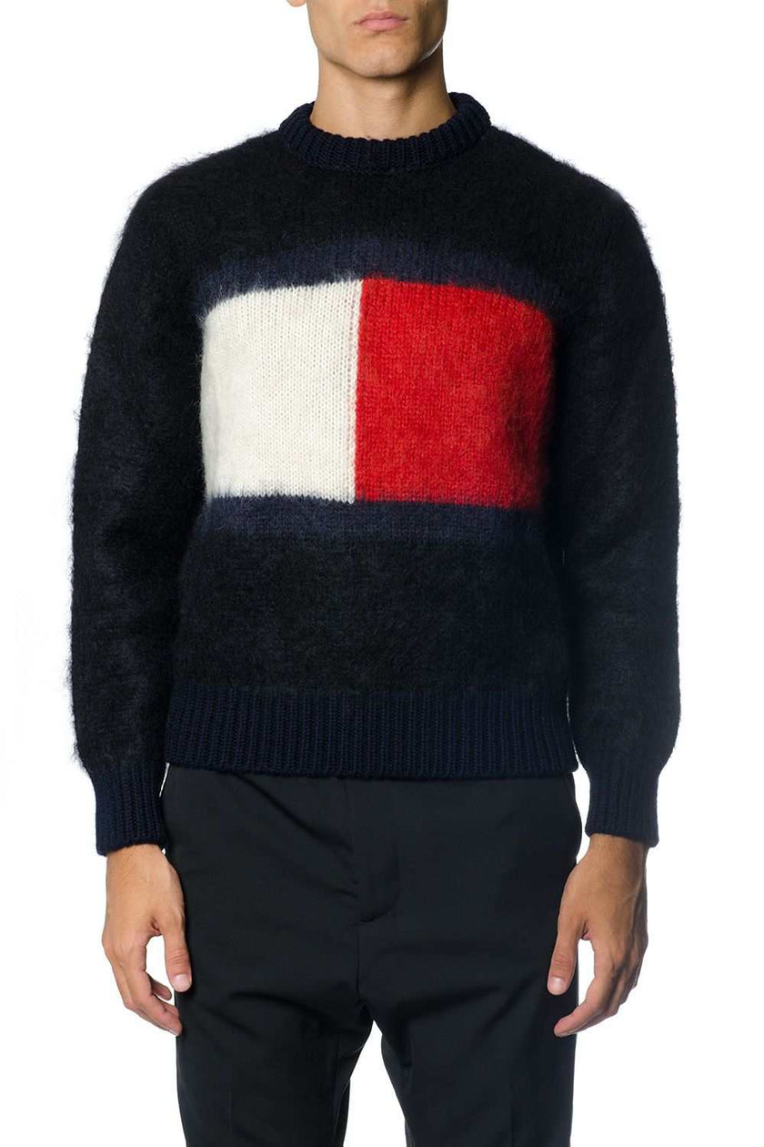 Men's black Tommy Hilfiger mohair crewneck sweater with large red and white flag logo on chest