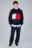 Men's black crewneck Tommy Hilfiger mohair sweater with large flag logo on chest