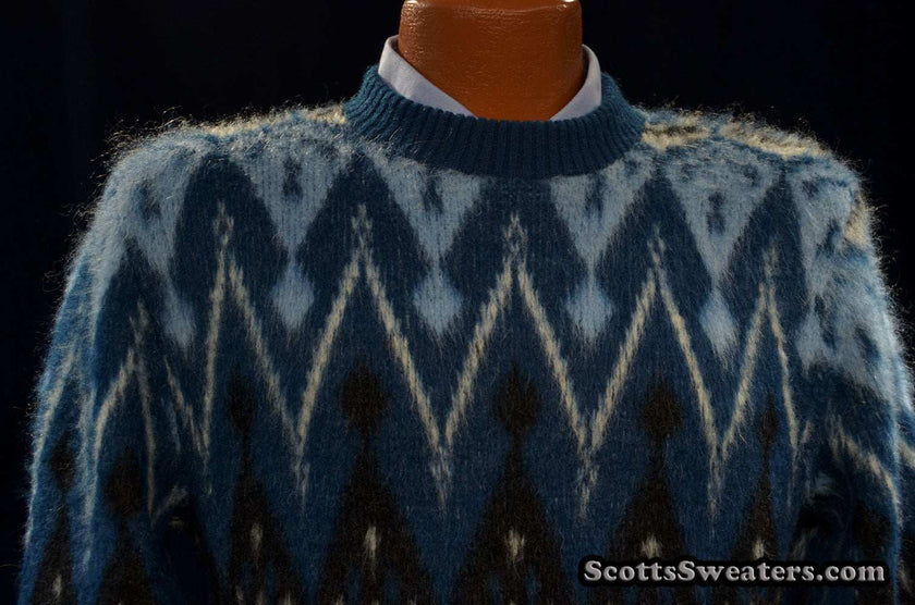 Blue fuzzy retro crewneck mohair sweater with black, light blue, and white geometric design