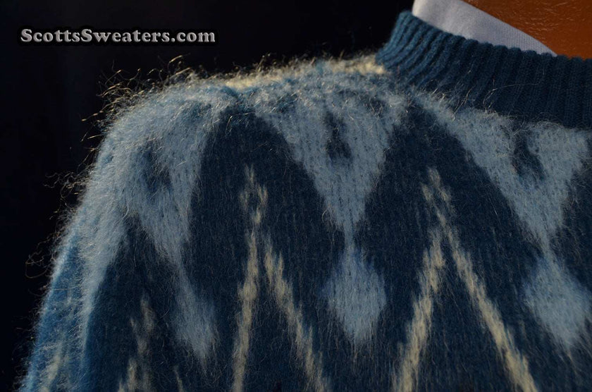 Blue fuzzy retro crewneck mohair sweater with black, light blue, and white geometric design by Campus, size X-Small