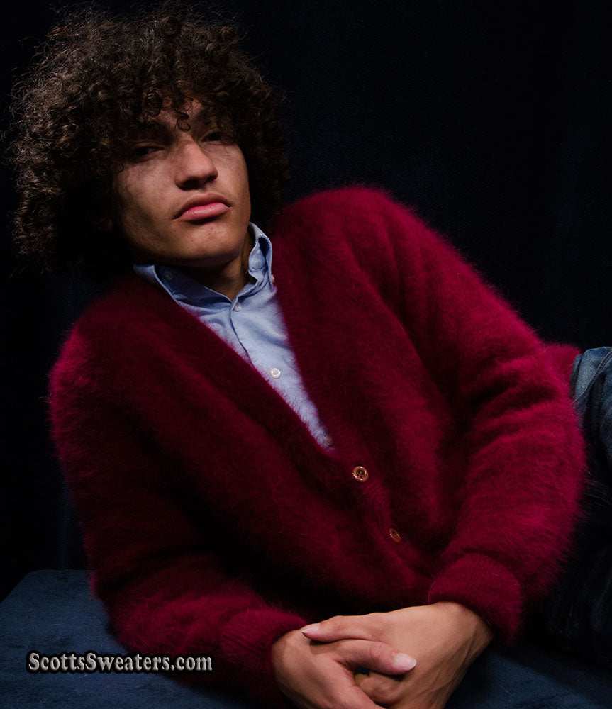 Men's ultra-soft angora cardigan sweater in deep red worn over blue shirt, luxury and warmth style