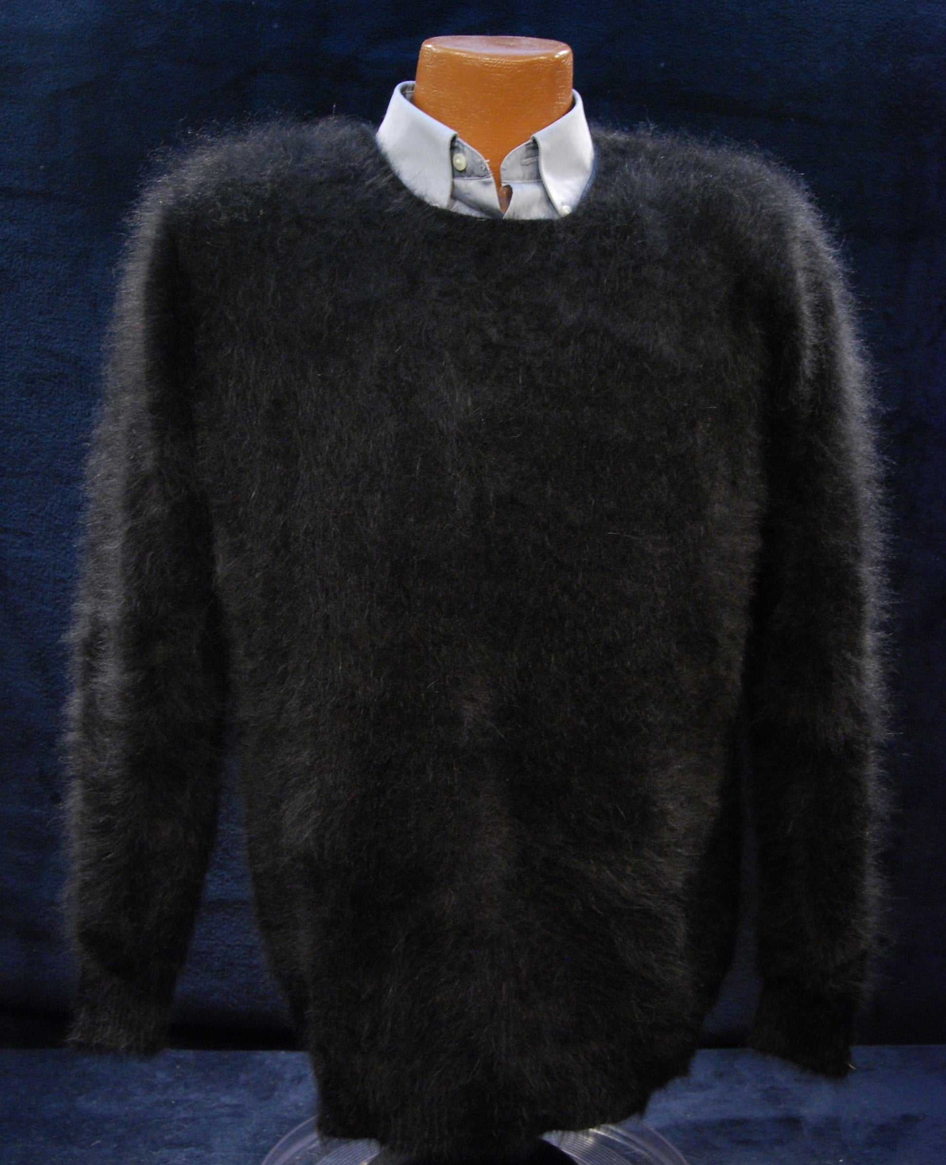 Men's ultra-soft black angora crewneck sweater layered over white dress shirt on mannequin