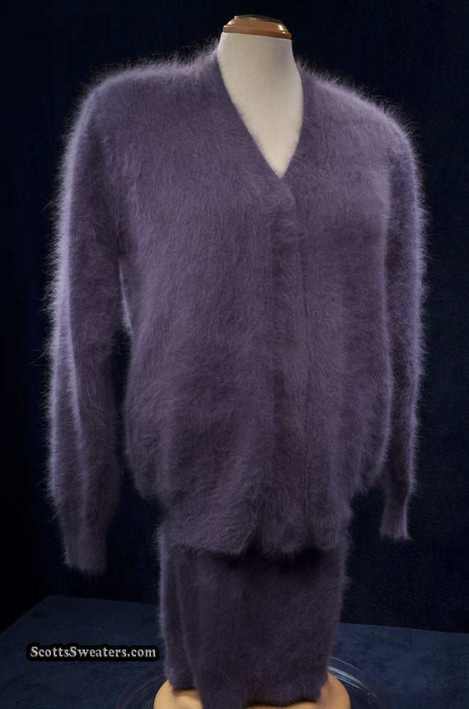 Woman wearing cinereous-grey 3-piece angora cardigan and skirts set with short and long skirts