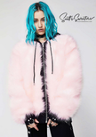 Punk style thick and fluffy pink faux-fur jacket with zipper front, hanging straps, and metal D-rings on cuffs.