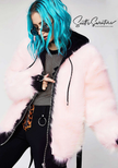 Punk style thick fluffy faux-fur jacket with zipper front, hanging straps, metal D-rings, and mohawk hood detail.