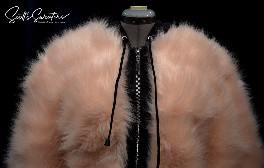 Punk style thick fluffy faux-fur jacket with zipper front and hanging straps on cuffs in pale pink