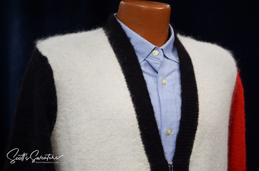 Unisex mohair cardigan sweater by WeSC with black, white, and red color blocks, styled over a light blue button-up shirt, skateboarder street wear.