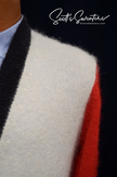 Close-up of WeSC skateboarder street wear unisex mohair cardigan sweater with black, white, and red color blocks