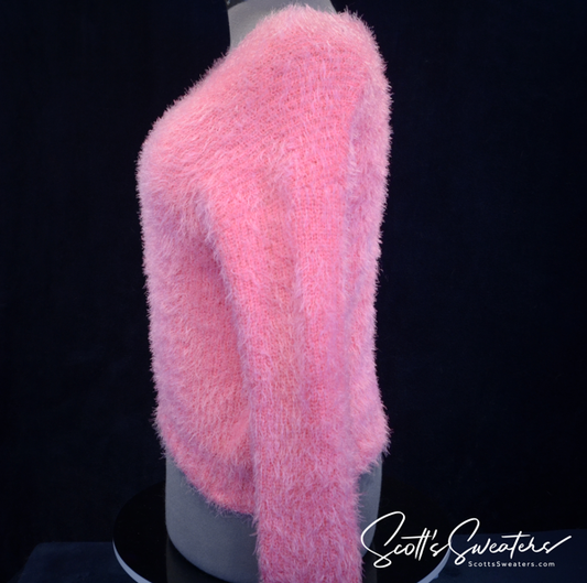 Woman's fuzzy hot-pink plush V-neck sweater side view on mannequin