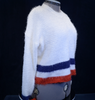 Woman's fuzzy white plush crewneck sweater with blue and red stripes on bottom and cuffs by Forever 21