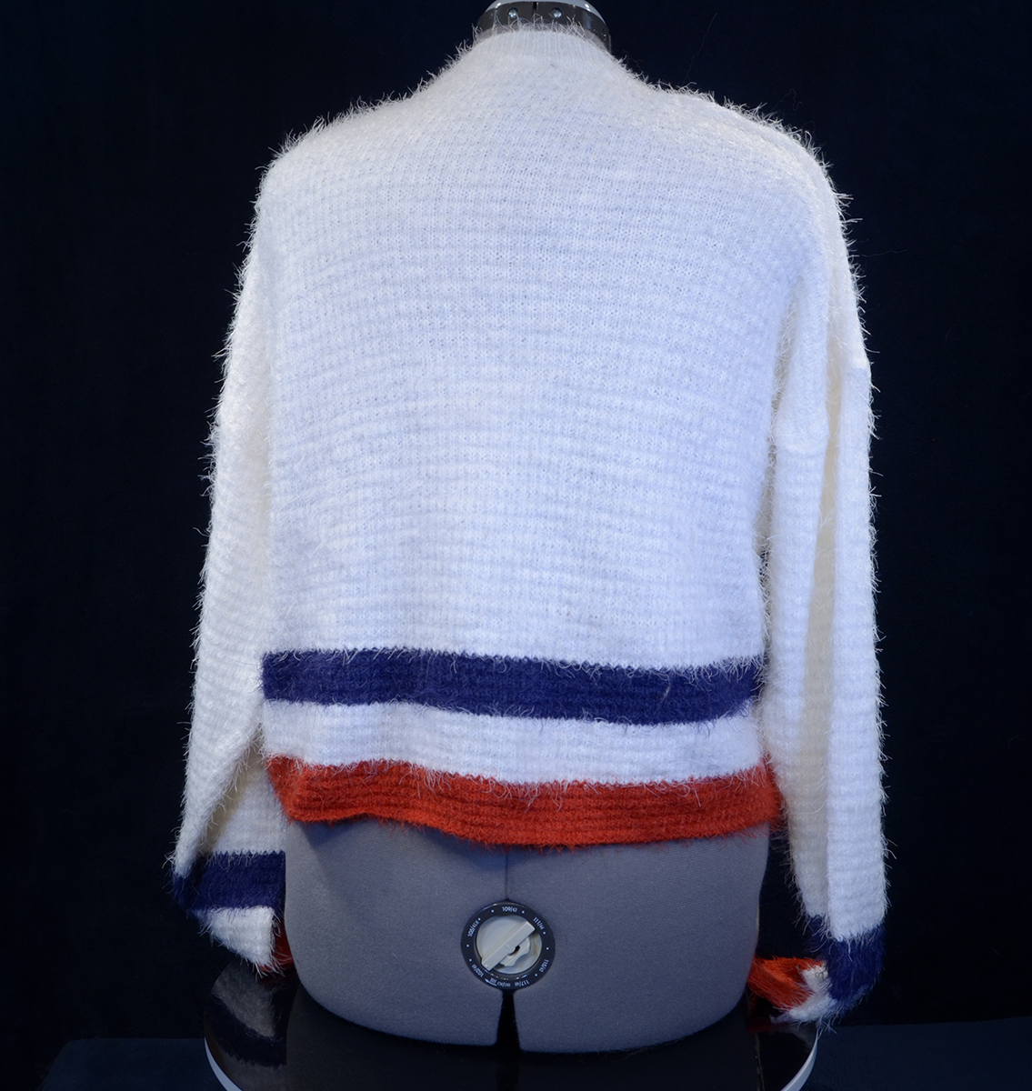 Woman's fuzzy white plush crewneck sweater with blue and red stripes on cuffs and hem by Forever 21