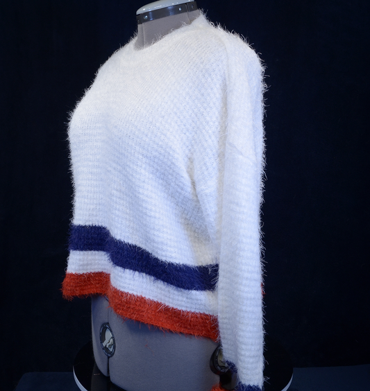 Woman's fuzzy white plush crewneck sweater with blue and red stripes at bottom and cuffs by Forever 21