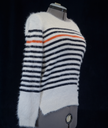 Woman's fuzzy white plush crewneck sweater with black and orange horizontal stripes by Anthropologie Moth
