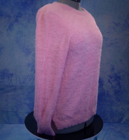 Girls's fuzzy pink plush crewneck sweater by Old Navy on mannequin against blue backdrop