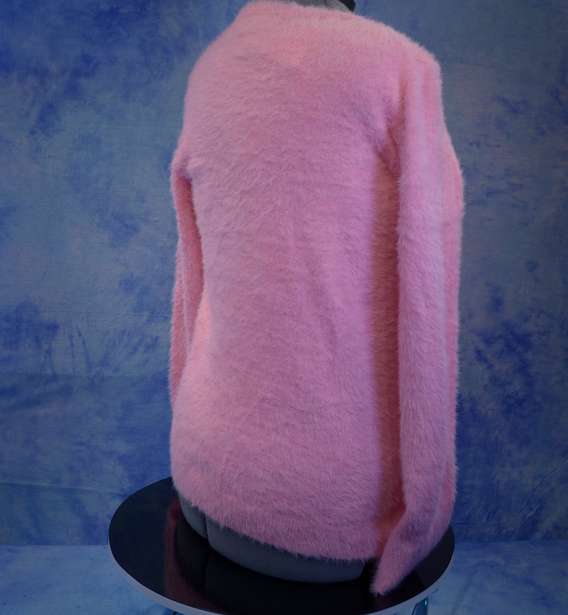 Girls's fuzzy pink plush crewneck sweater by Old Navy displayed from the back