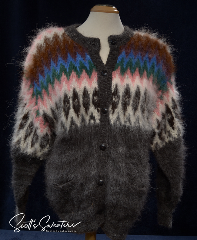 Woman wearing a colorful ultra-soft grey Bolivian alpaca cardigan sweater with multi-color ethnic stripes and wooden buttons.