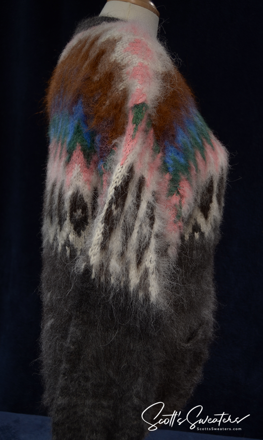 Woman wearing colorful ultra-soft grey alpaca cardigan with multi-color ethnic stripes and wooden buttons