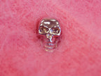 Women's pink angora cardigan sweater with chrome skull buttons