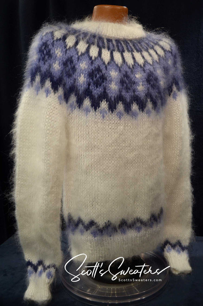 White men's hand-knit mohair turtleneck sweater with blue yoke pattern by Scott's Sweaters