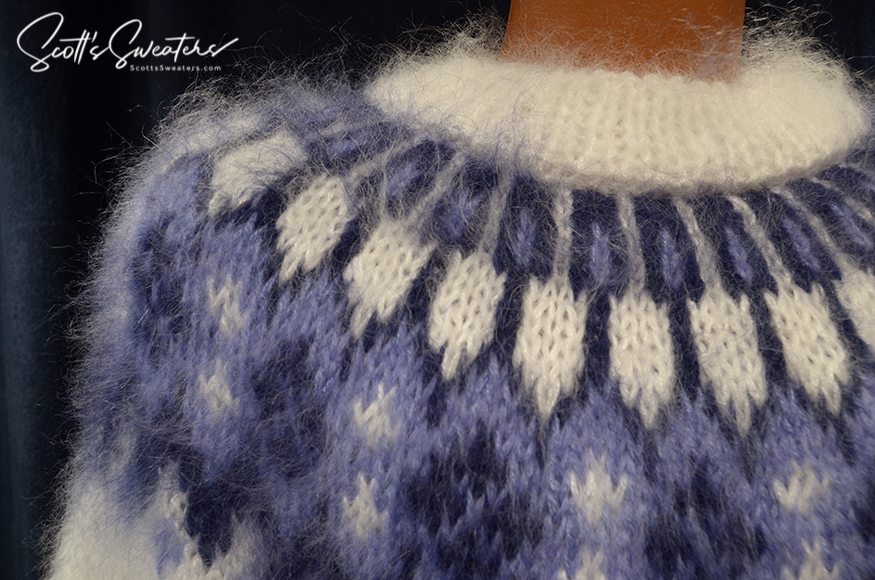 Men's hand-knit white mohair turtleneck sweater with blue yoke pattern by Scott's Sweaters
