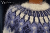 Men's hand-knit white mohair turtleneck sweater with blue yoke pattern by Scott's Sweaters