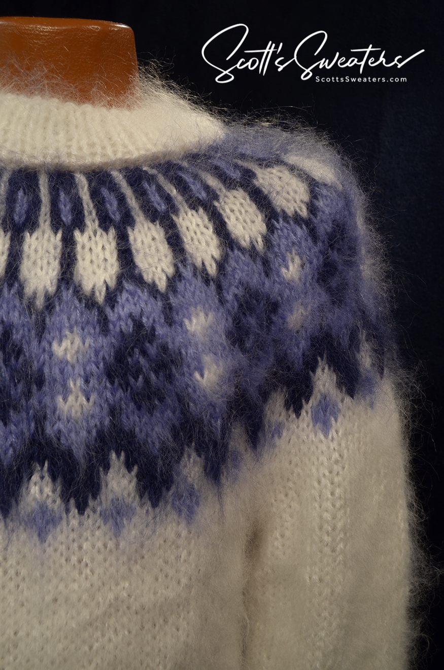 White men's hand-knit mohair turtleneck sweater with blue yoke pattern by Scott's Sweaters