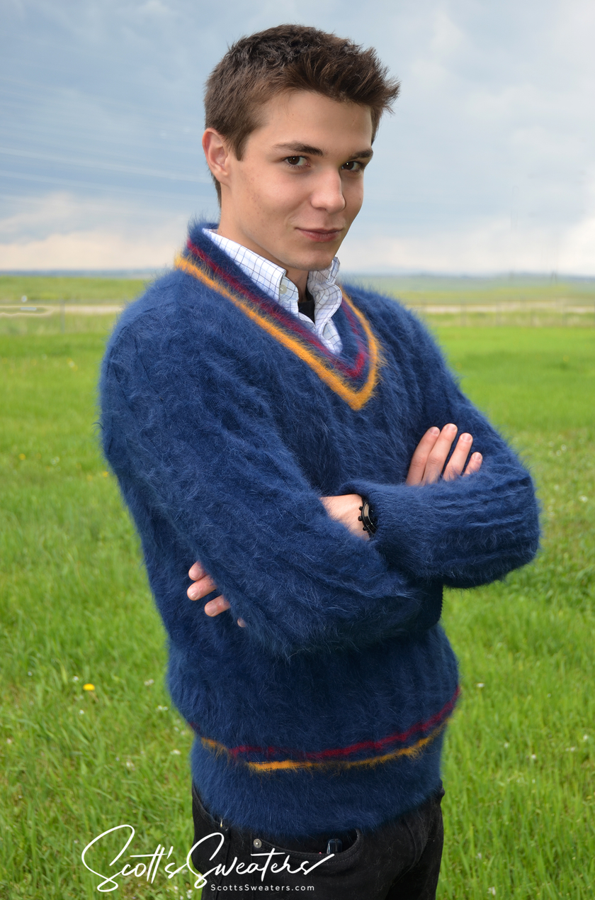 Men's ultra-soft angora cableknit tennis sweater in blue with red and gold trim, classic style.