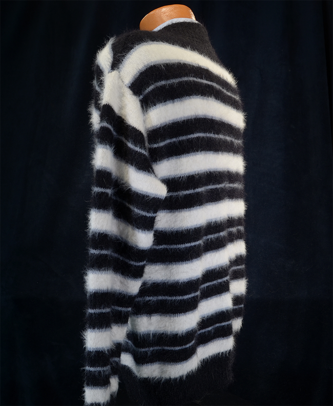 Men's striped fuzzy crewneck mohair sweater in black and white stripes on mannequin against dark background