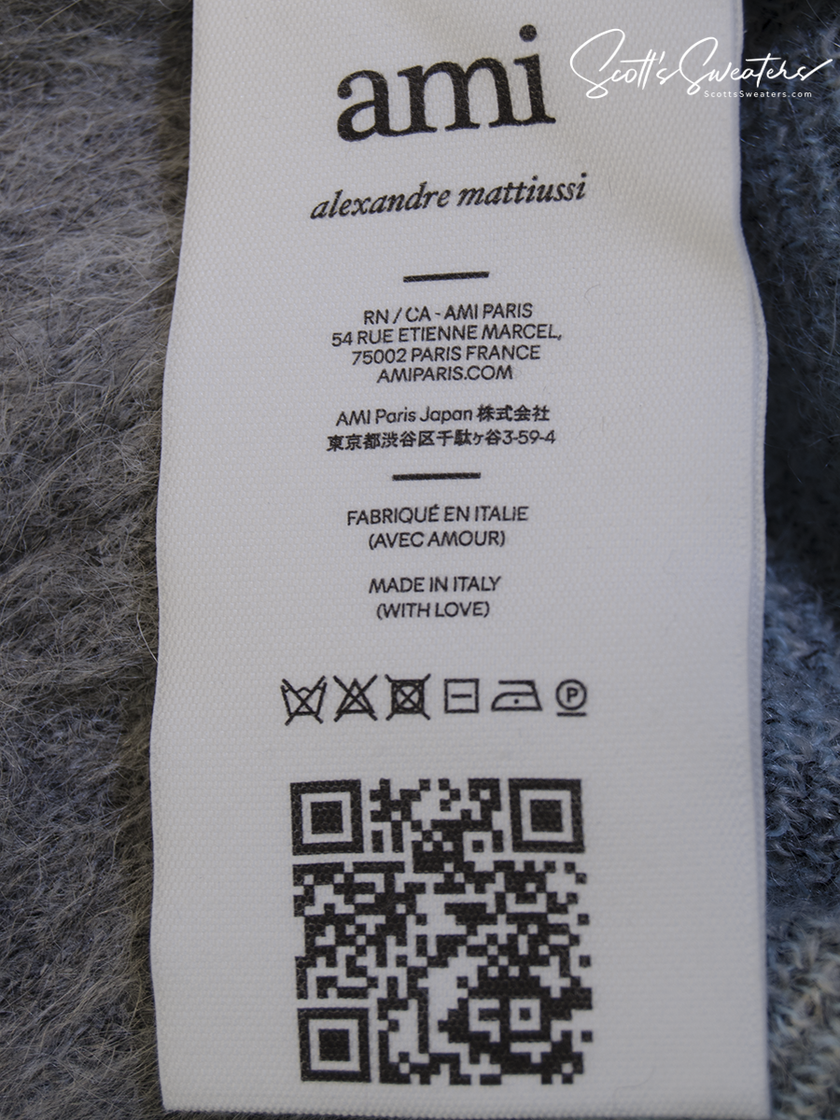Care label of Men's Alpaca/Mohair Grey Argyle Cardigan Sweater by AMI - Alexandre Mattiussi showing fabric details and care instructions