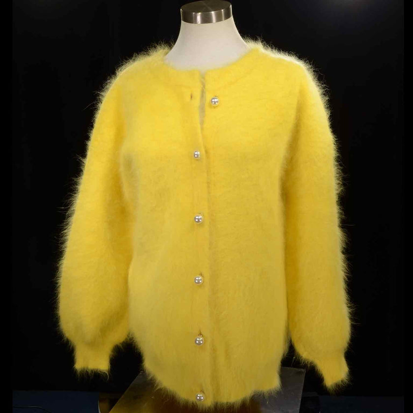 Yellow woman's angora sweater cardigan with pearl buttons and textured knit, size small