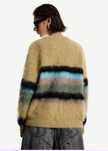 Fuzzy Open-Front Cardigan in tan with multicolored horizontal stripes and a soft, fuzzy texture made from synthetic fibers.