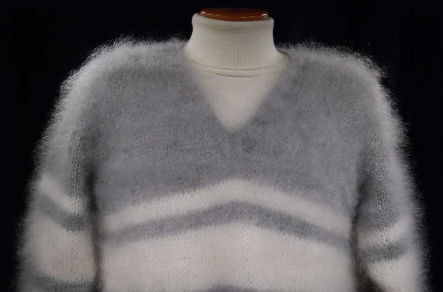 Extra soft men's kid mohair sweater in light gray with white stripes, hand-knit and fluffy texture on a mannequin.