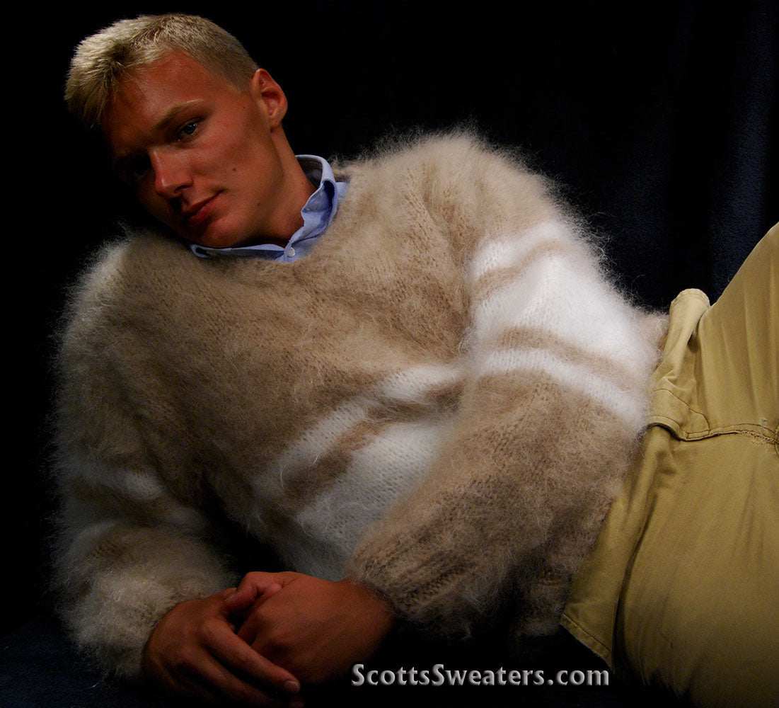 Man wearing extra soft hand-knit men's kid mohair sweater in beige and white stripes reclining