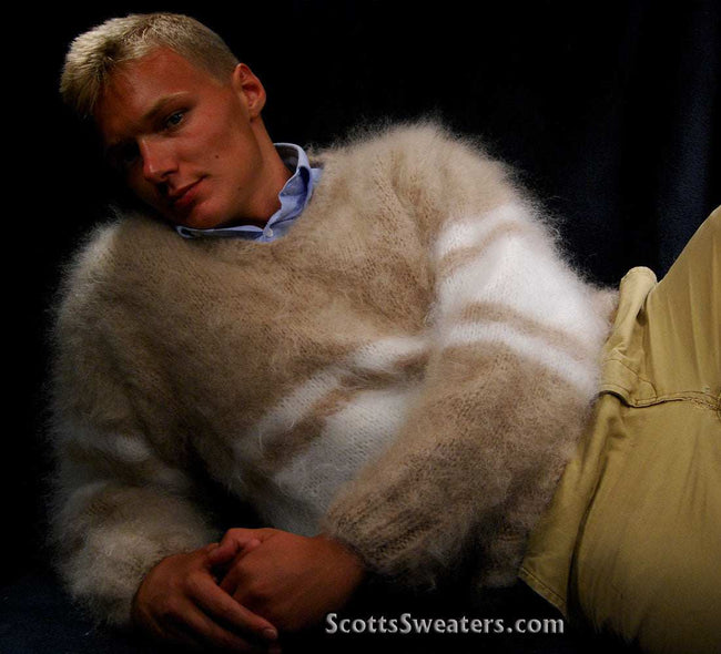 Man wearing extra soft hand-knit men's kid mohair sweater in beige and white stripes reclining
