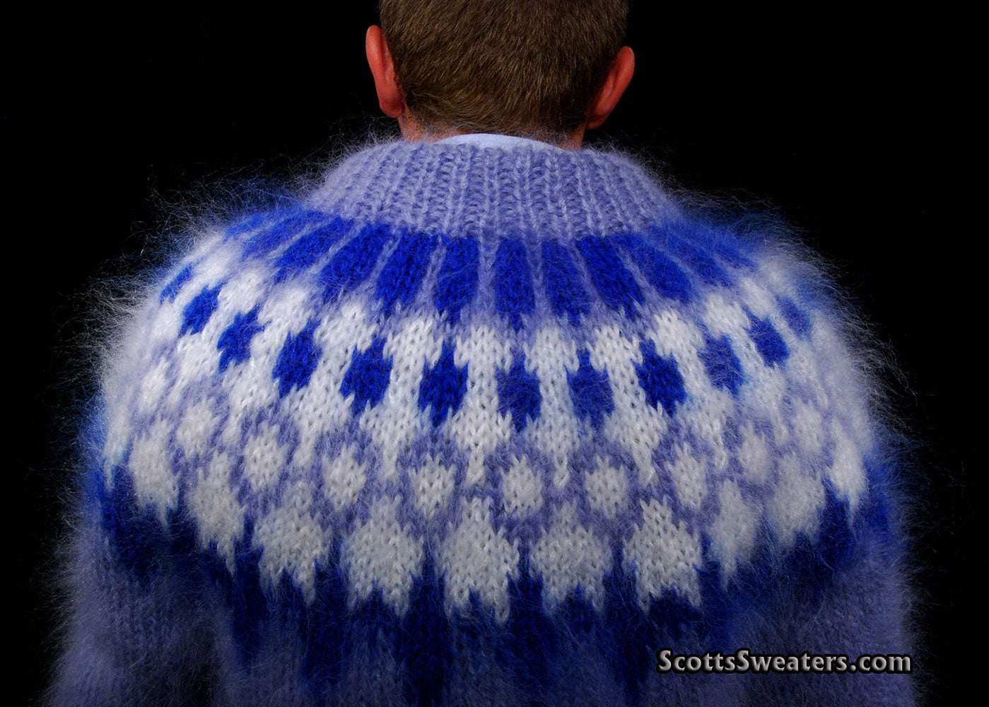 Back view of hand-knit men's mohair cardigan sweater with blue and white fuzzy pattern