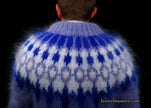 Back view of hand-knit men's mohair cardigan sweater with blue and white fuzzy pattern