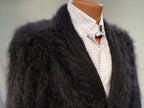 Men's black hand-spun angora-silk sweater with soft brushed fibers, styled over a white checkered shirt