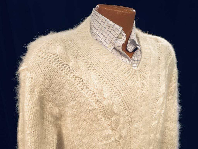 Men's home-spun angora-silk hand-knit cream cable-knit sweater on mannequin with checkered shirt