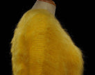 Woman's fuzzy yellow hand-knit mohair sweater with double V-neck design on a mannequin