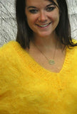 Woman wearing fuzzy yellow mohair double V-neck sweater by Scott's Sweaters