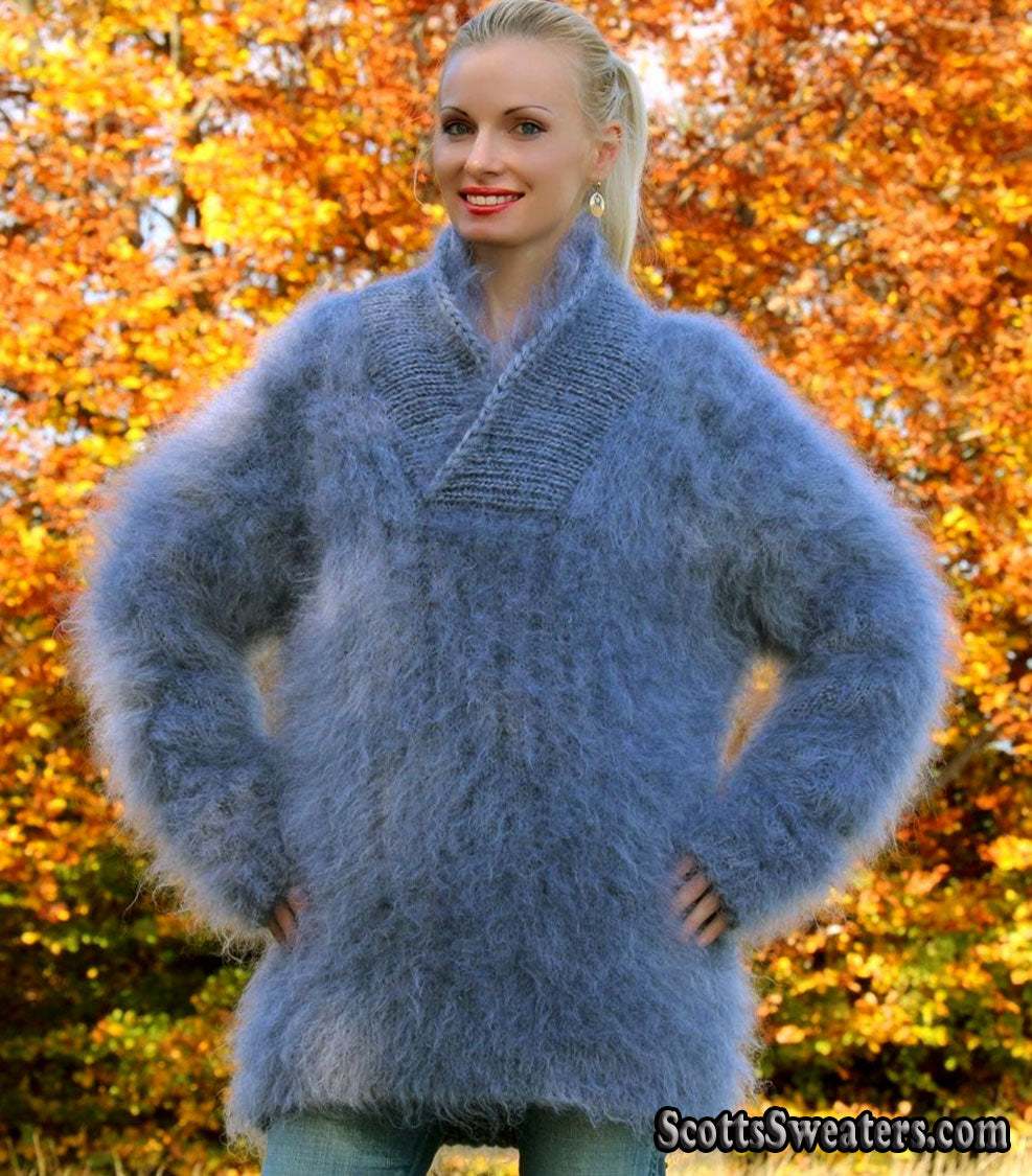 Unisex hand-knit mohair sweater with cross-over neck in soft blue color worn outdoors in autumn setting